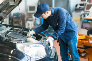 Mechanic Working on Japanese Automobile