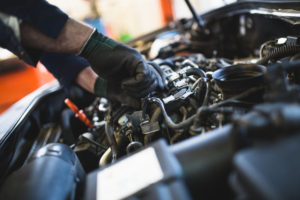 Mechanic working on car